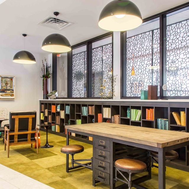 The Arnold - Lounge Area with Wood style Wall and Cozy Lighting