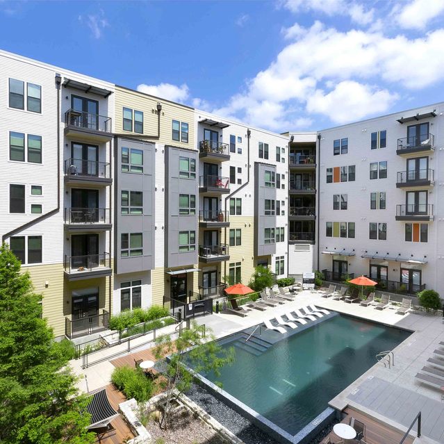 The Arnold - Apartment Building Exterior View with Semi Aerial View of Pool