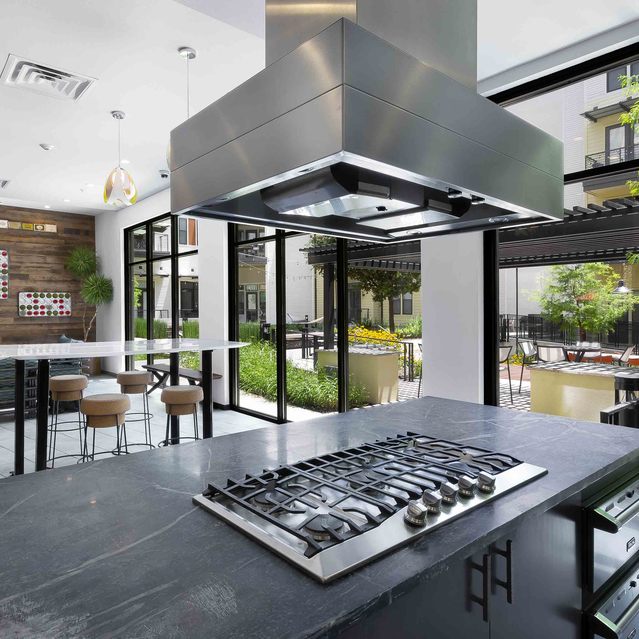 The Arnold - Indoor Grilling Area with Seating and Outdoor View