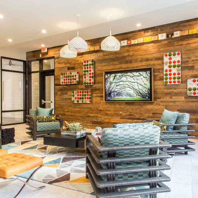 The Arnold - Lounge Area with Wood style Wall and Cozy Lighting