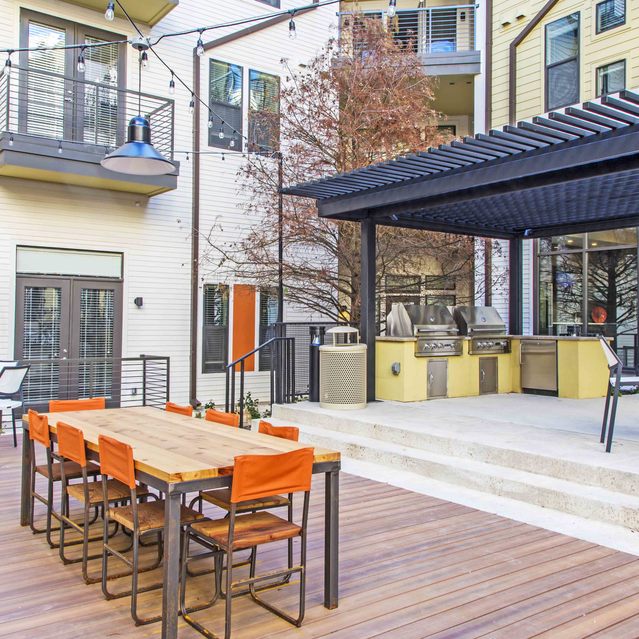The Arnold - Outdoor Seating with Table and a Covered Area