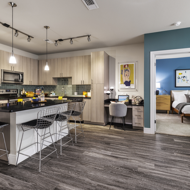 The Arnold - Kitchen and Dining Area with View of Bedroom